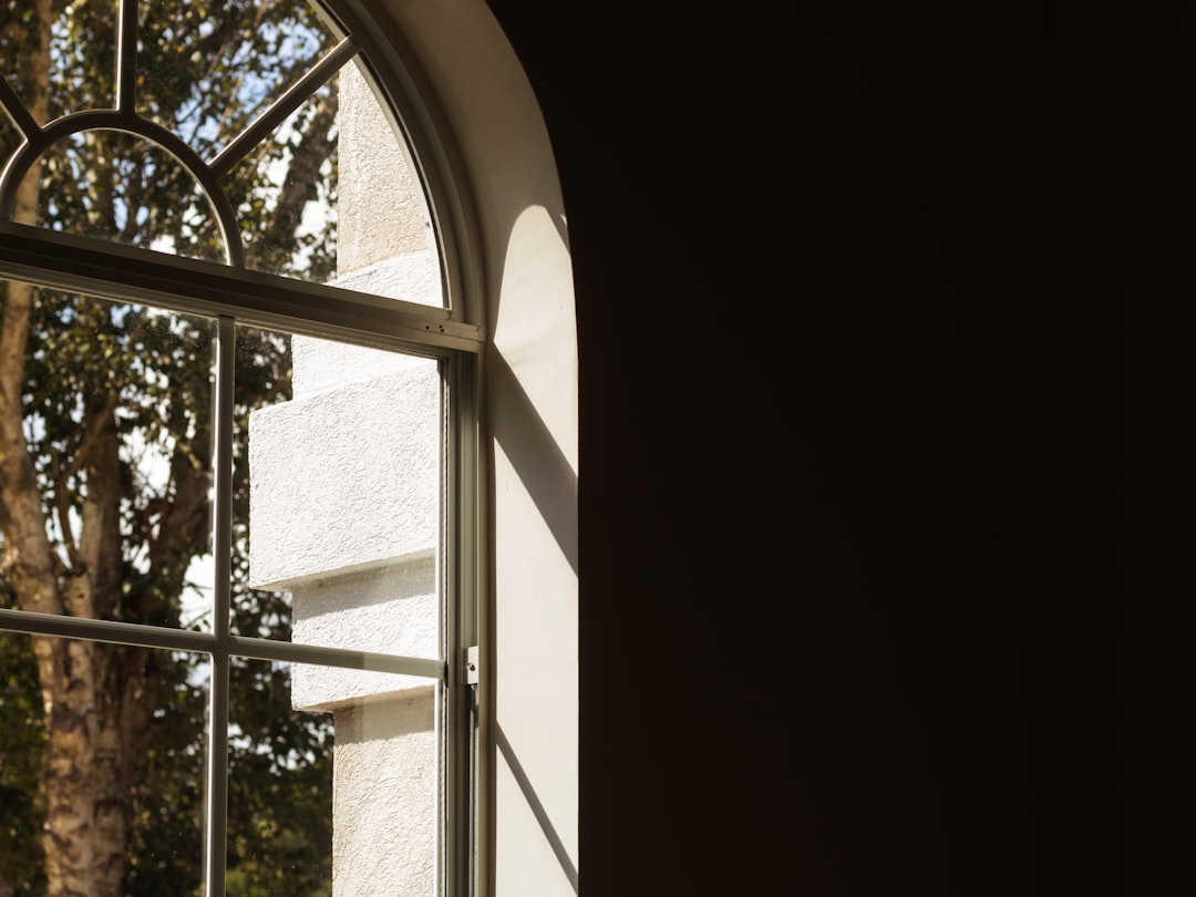 a white building with a metal frame